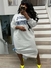 Plus-Size Casual Dress for Women, Featuring a Stylish Printed Color-Blocked Design with a Slit, Resembling a Sweatshirt Dress.