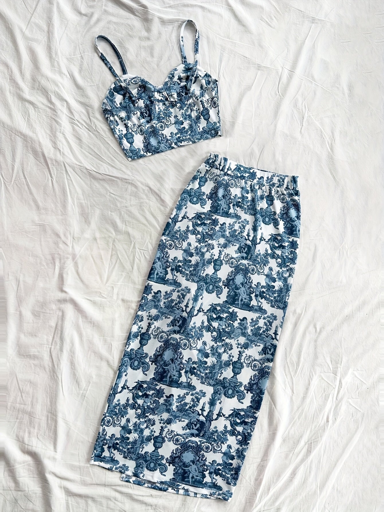 Spring and summer new arrivals: Beach vacation portrait print halter top and side slit skirt.
