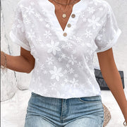 Women'S Loose White Shirt with a Summer Floral Pattern And a V-Neck Batwing Sleeve Design.