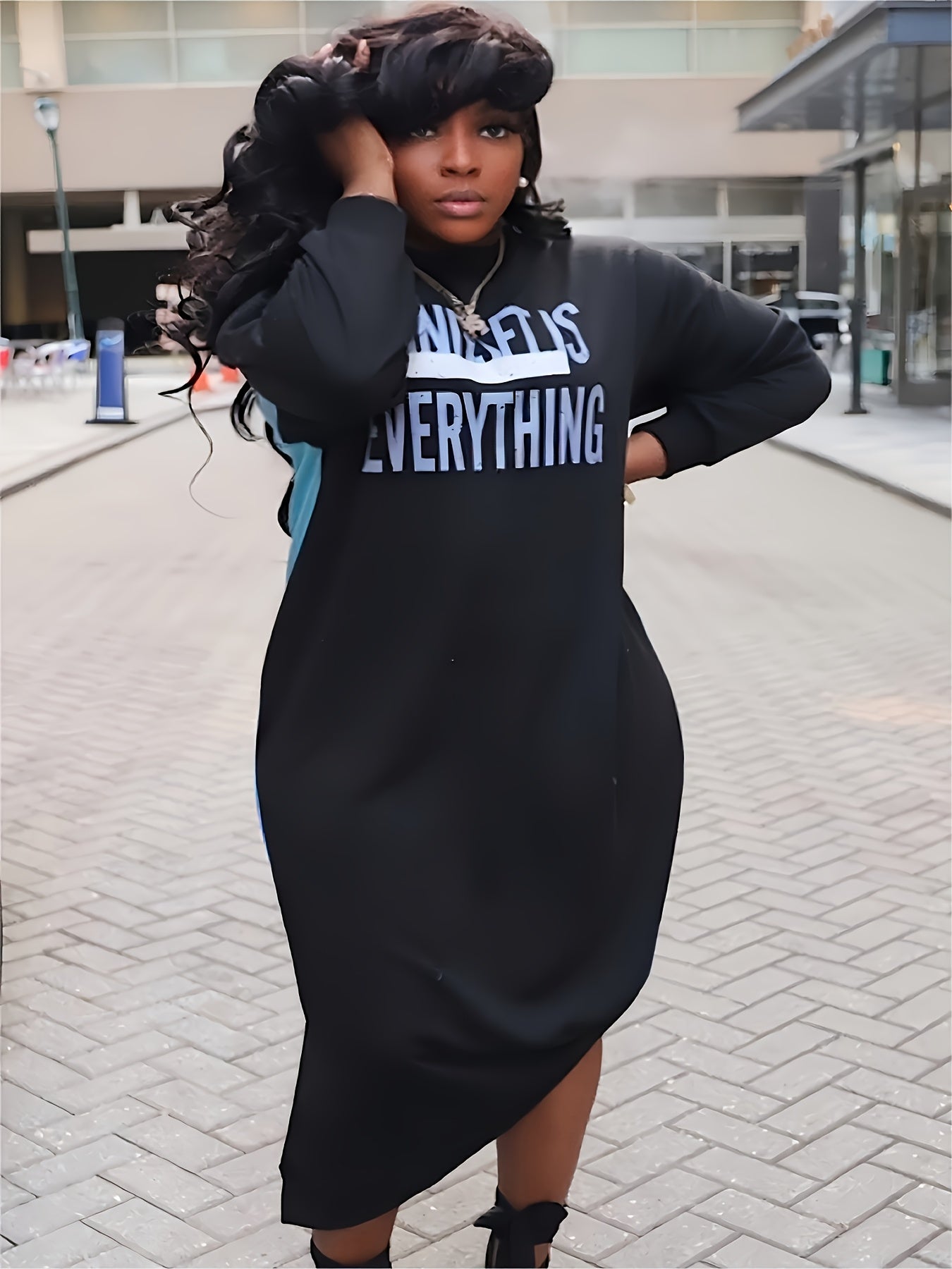 Plus-Size Casual Dress for Women, Featuring a Stylish Printed Color-Blocked Design with a Slit, Resembling a Sweatshirt Dress.