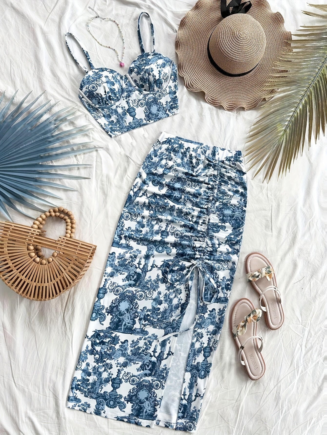Spring and summer new arrivals: Beach vacation portrait print halter top and side slit skirt.