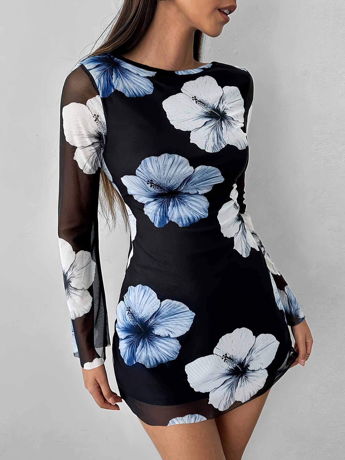 A Mini Dress with a Floral Print That Is Sexy And Elegant, Featuring a Backless Design And Breathable Long Sleeves.