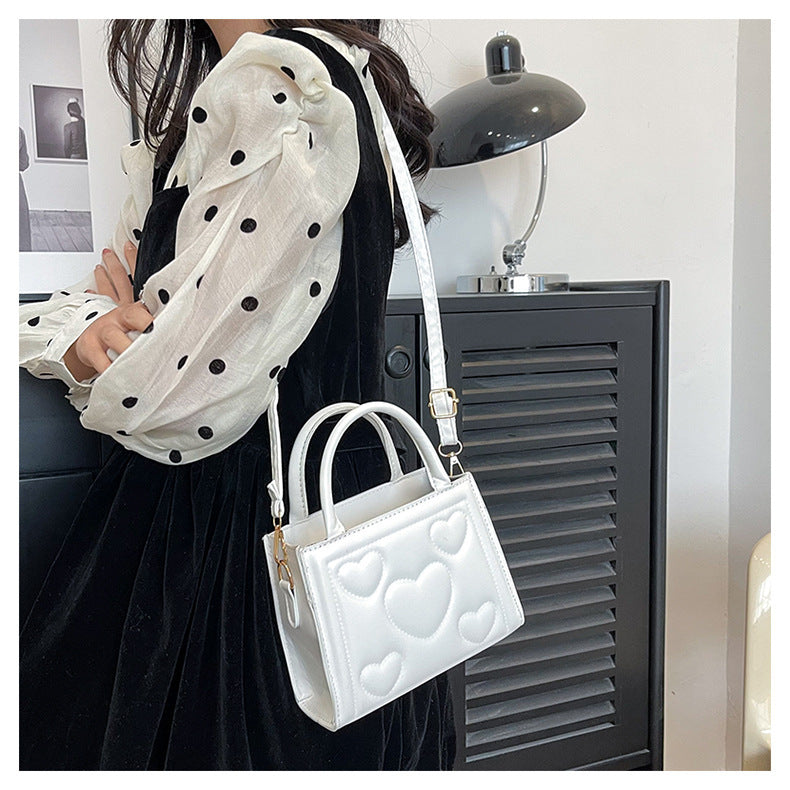 1pc Women’s Stylish Solid Color Handbag with Detachable Strap – Heart Pattern Design, Perfect for Valentine’s Day Gift, Available in Magenta, White, Black, Green, Yellow