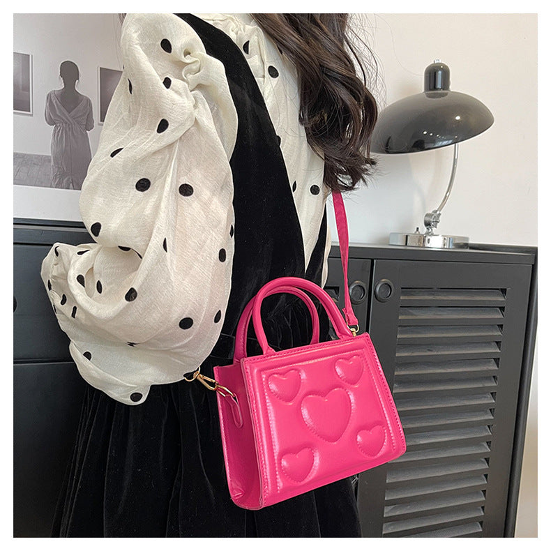 1pc Women’s Stylish Solid Color Handbag with Detachable Strap – Heart Pattern Design, Perfect for Valentine’s Day Gift, Available in Magenta, White, Black, Green, Yellow